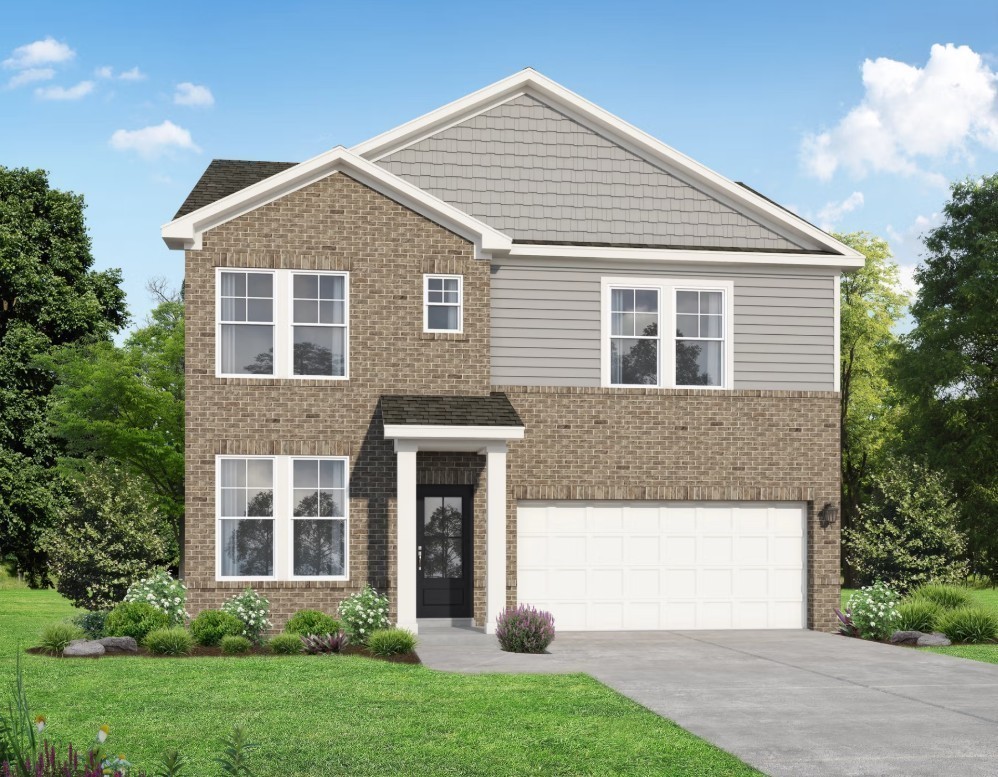 2155 Barnwood Road Gallatin, TN 37066 - Photo 38 of 51 a front view of a house with a yard and garage