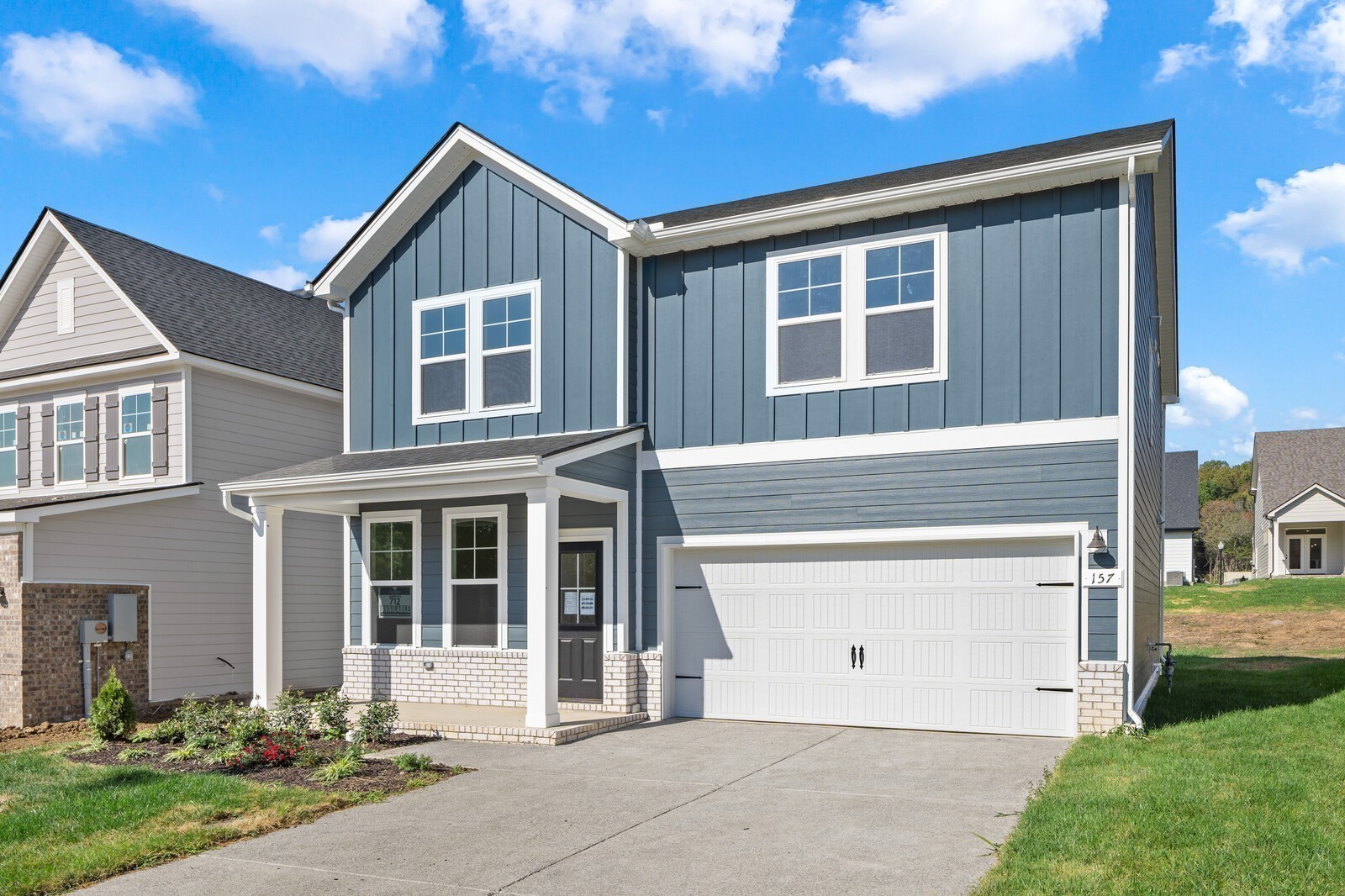2155 Barnwood Road Gallatin, TN 37066 - Photo 5 of 51 a front view of a house with a yard and garage