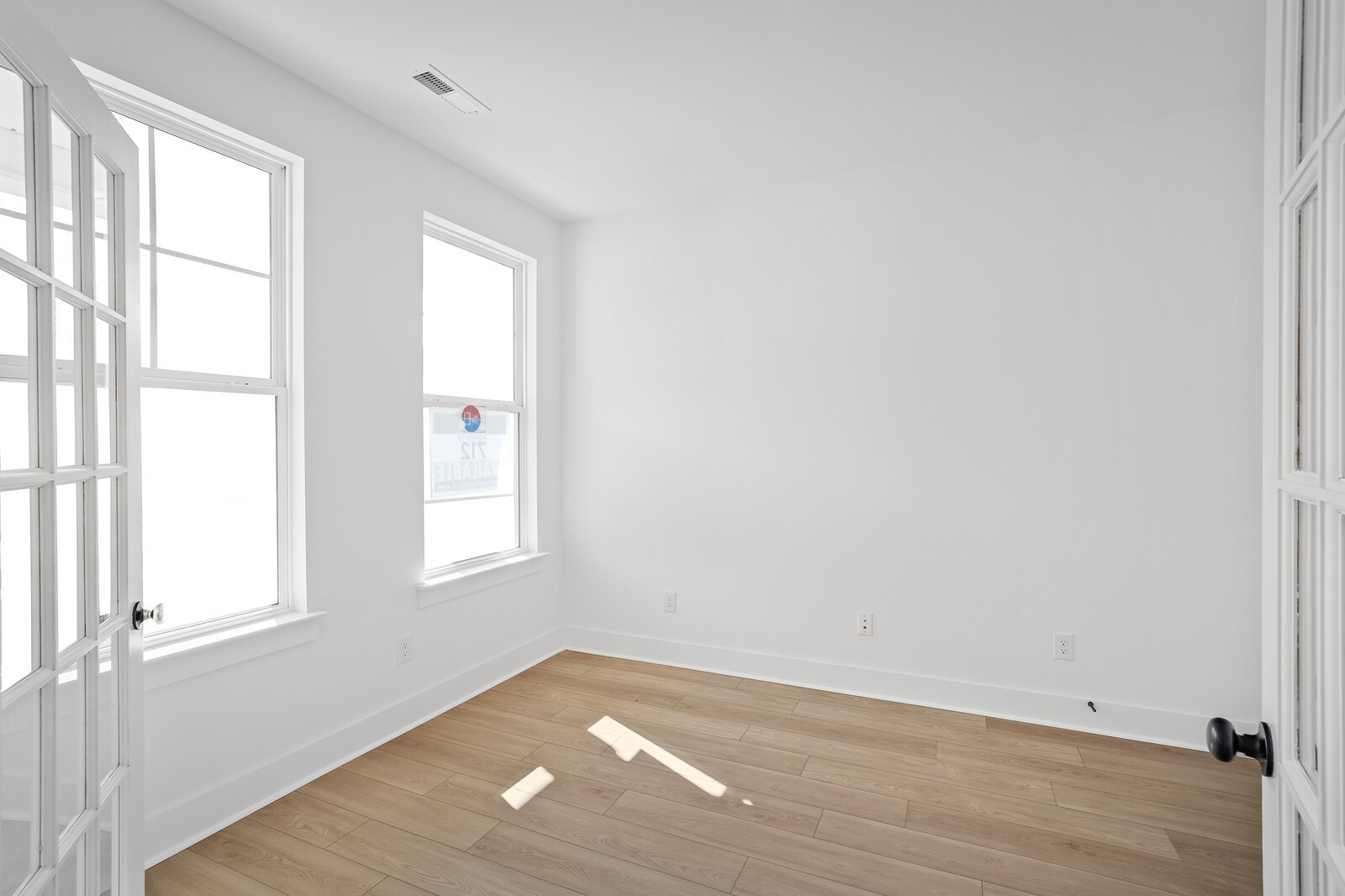 2155 Barnwood Road Gallatin, TN 37066 - Photo 10 of 51 an empty room with wooden floor and windows