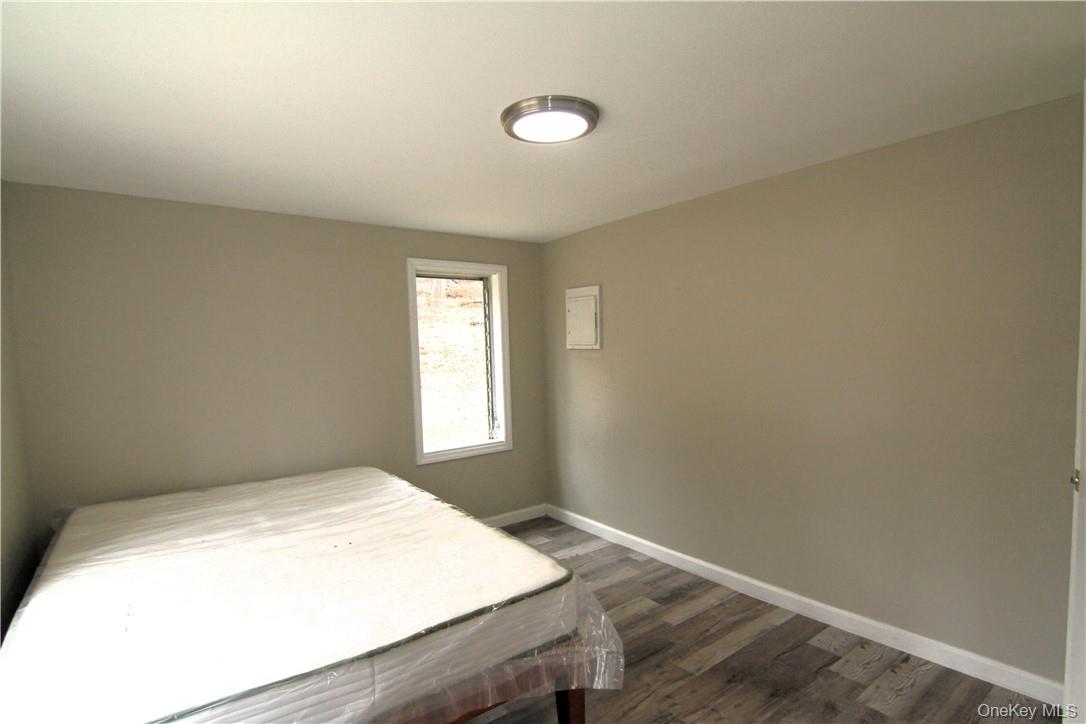 71 Miller Road, Unit 6 Hopewell Junction, NY 12533 - Photo 12 of 22 a bedroom with a bed and a window