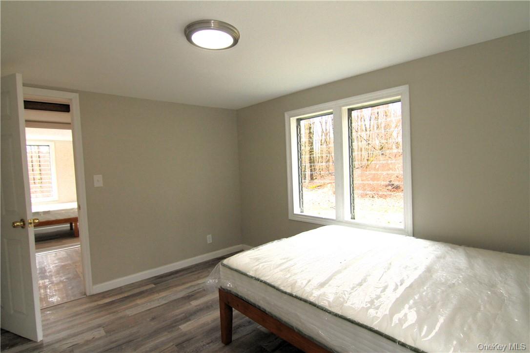 71 Miller Road, Unit 6 Hopewell Junction, NY 12533 - Photo 13 of 22 a view of a room with wooden floor and windows