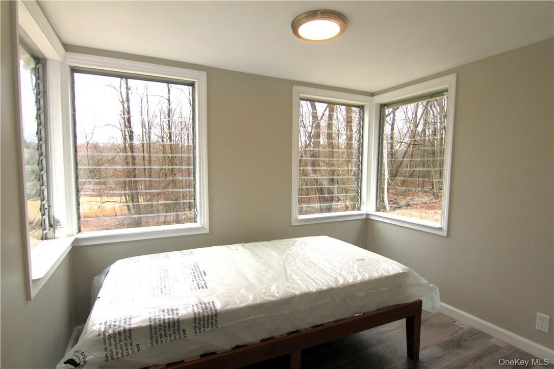 71 Miller Road, Unit 6 Hopewell Junction, NY 12533 - Photo 14 of 22 a bed sitting in a bedroom next to a window