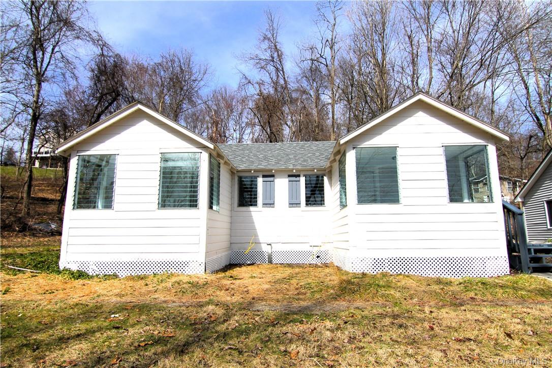 71 Miller Road, Unit 6 Hopewell Junction, NY 12533 - Photo 18 of 22 a front view of a house with a yard and garage