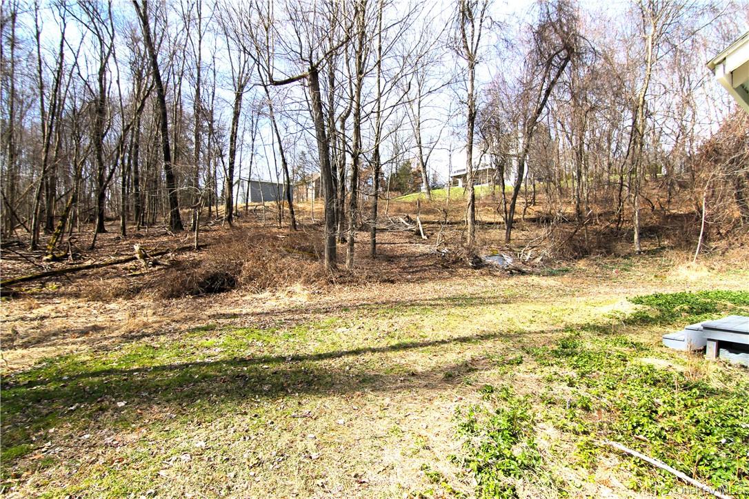 71 Miller Road, Unit 6 Hopewell Junction, NY 12533 - Photo 4 of 22 a swimming pool with trees in the background