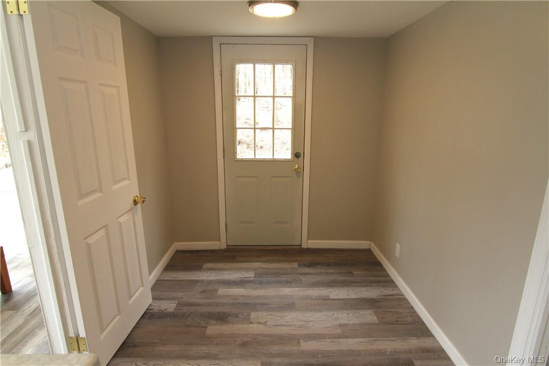 71 Miller Road, Unit 6 Hopewell Junction, NY 12533 - Photo 5 of 22 a view of room with window and hardwood floor