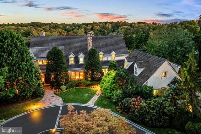 an aerial view of a house having swimming pool garden and patio