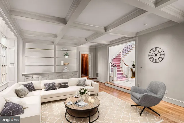 a living room with furniture tv and a large window