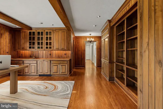 a view of a dining room with furniture large windows and wooden floor