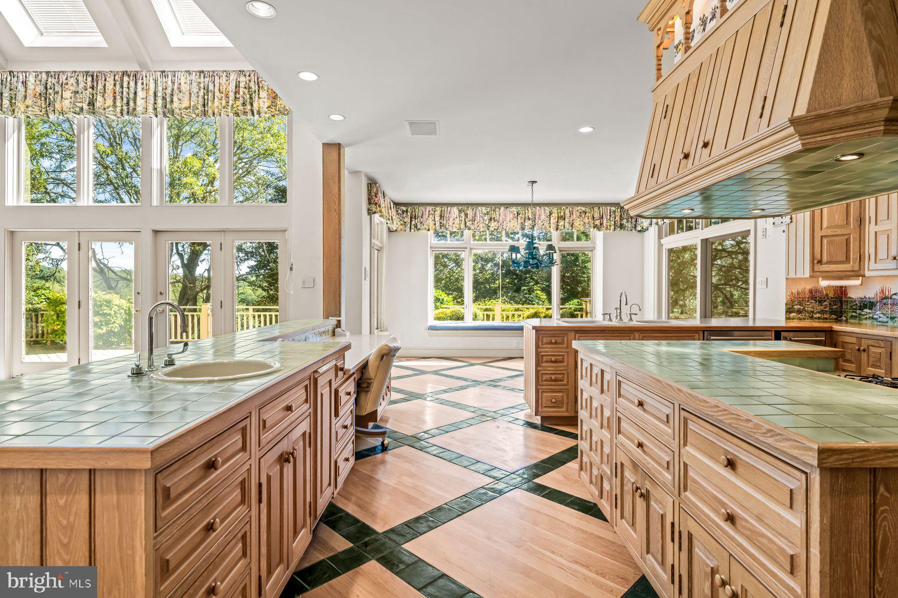 1225 Country Club Road Gladwyne, PA 19035 - Photo 24 of 89 a kitchen with counter top space and windows