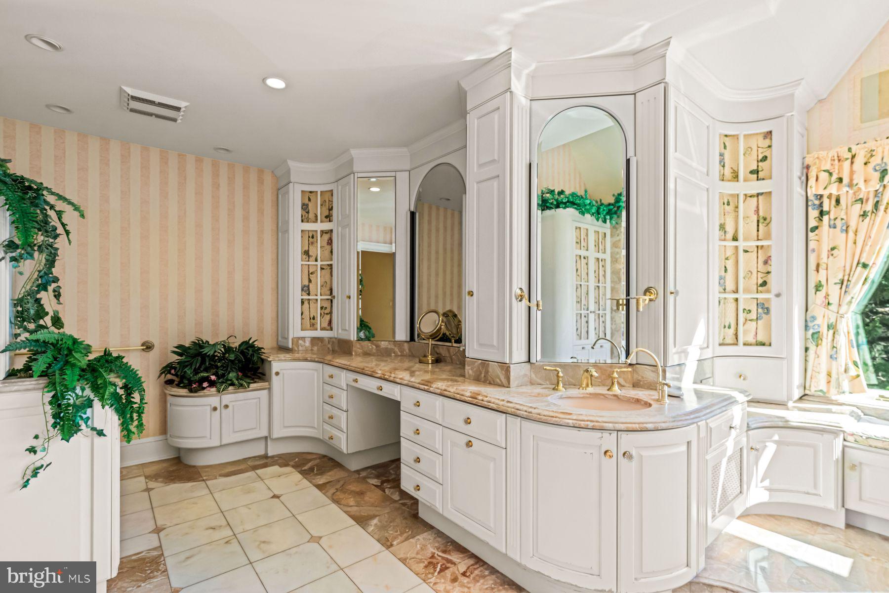 1225 Country Club Road Gladwyne, PA 19035 - Photo 39 of 89 a spacious en suite bathroom with a granite countertop tub and a sink