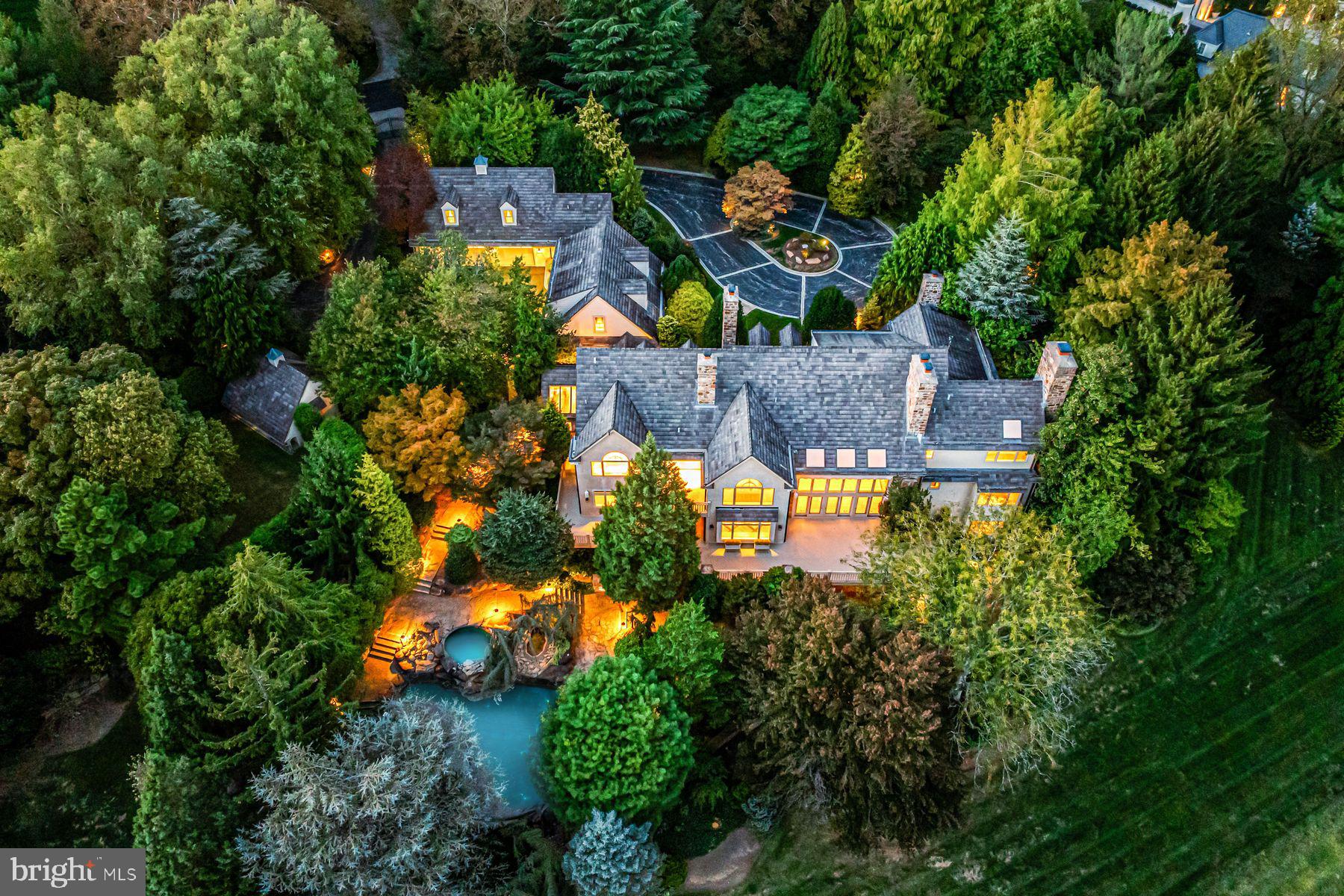 1225 Country Club Road Gladwyne, PA 19035 - Photo 4 of 89 an aerial view of a house with yard swimming pool and outdoor seating