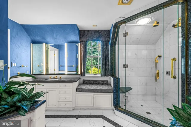 a kitchen with stainless steel appliances granite countertop a stove a sink and a refrigerator with wooden floor