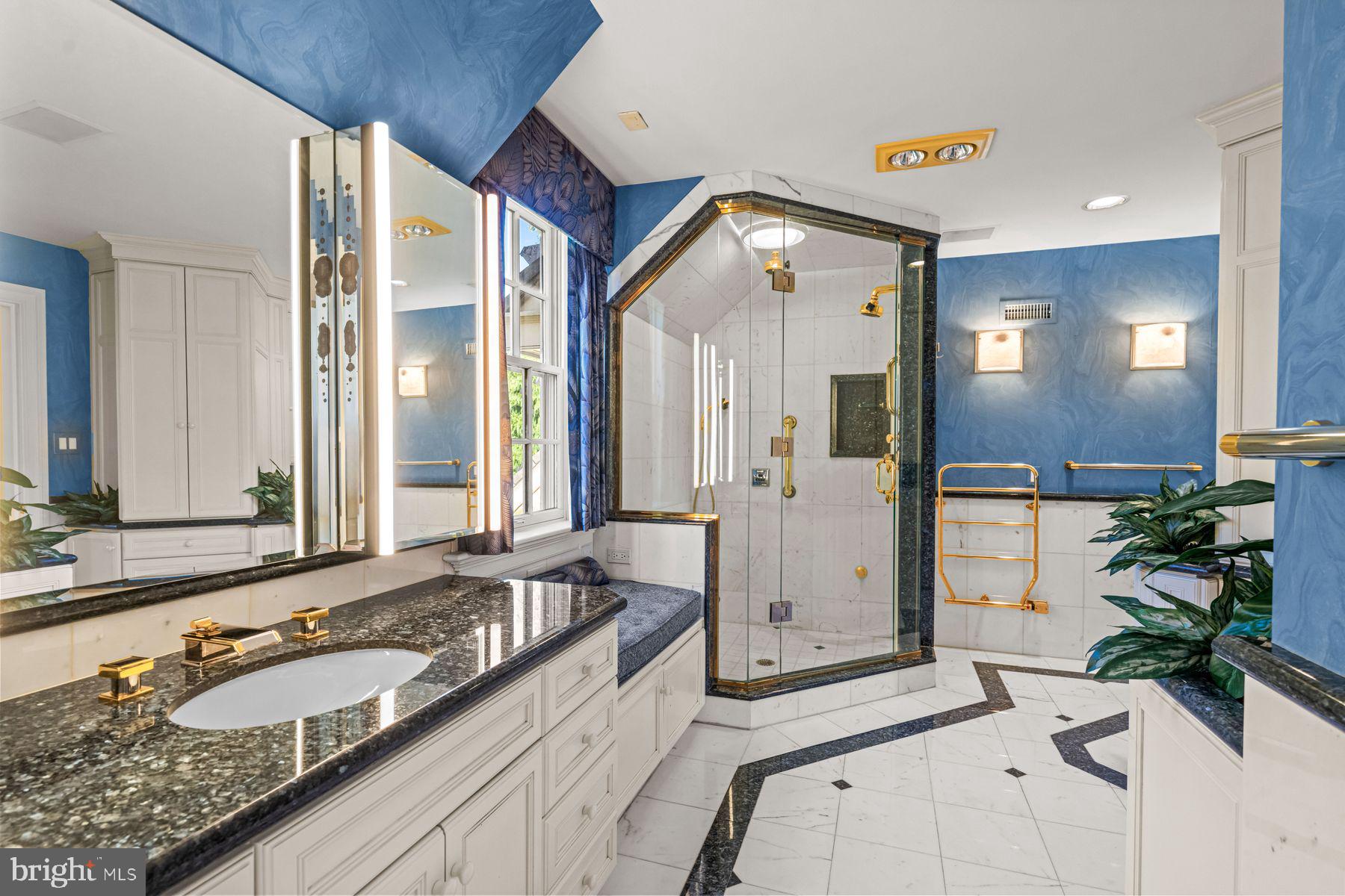1225 Country Club Road Gladwyne, PA 19035 - Photo 47 of 89 a spacious bathroom with a granite countertop sink and a large mirror
