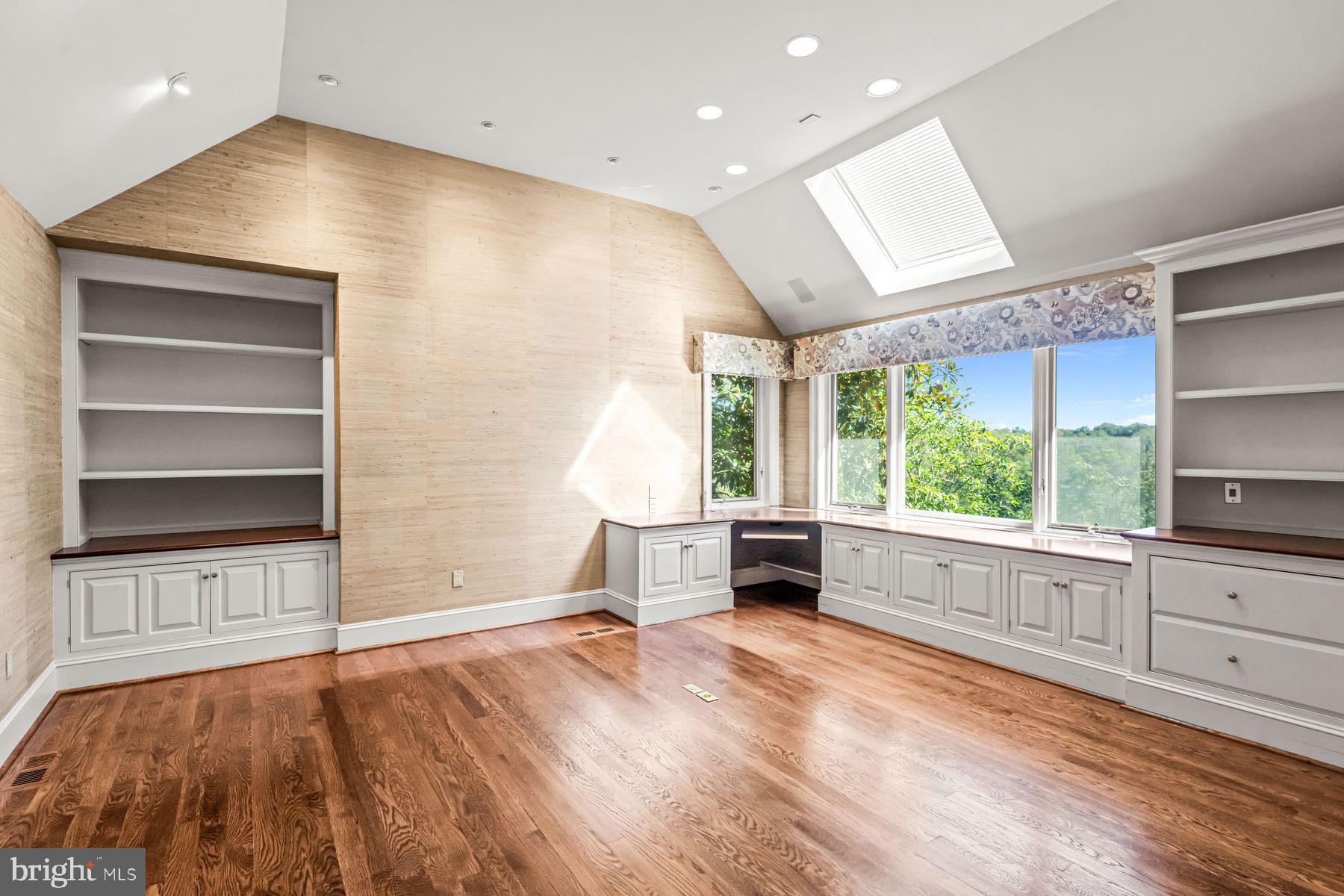 1225 Country Club Road Gladwyne, PA 19035 - Photo 48 of 89 a view of an empty room with a window and wooden floor