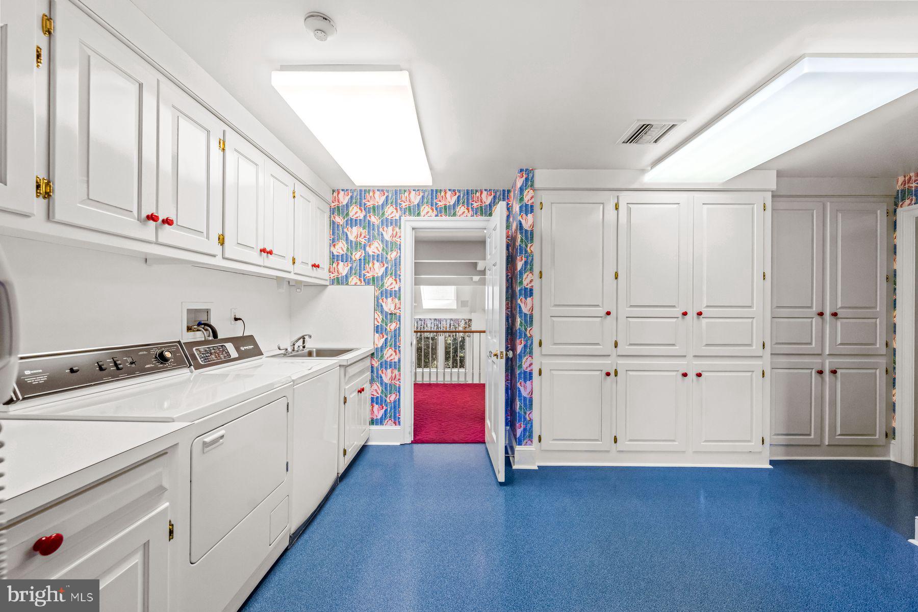 1225 Country Club Road Gladwyne, PA 19035 - Photo 60 of 89 a kitchen with granite countertop white cabinets and white appliances