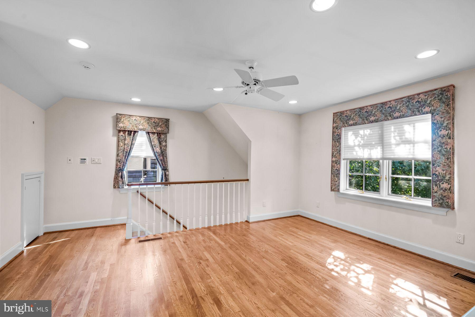 1225 Country Club Road Gladwyne, PA 19035 - Photo 76 of 89 a view of an empty room with wooden floor and a window