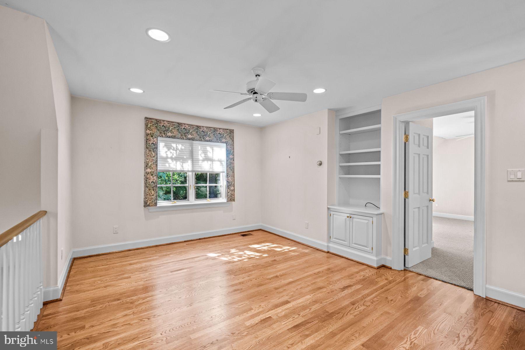 1225 Country Club Road Gladwyne, PA 19035 - Photo 77 of 89 a view of empty room with wooden floor and fan