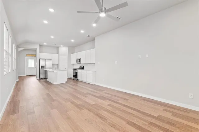 a view of kitchen and refrigerator