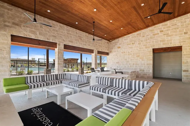 a view of a patio with couches chairs dining table and chairs