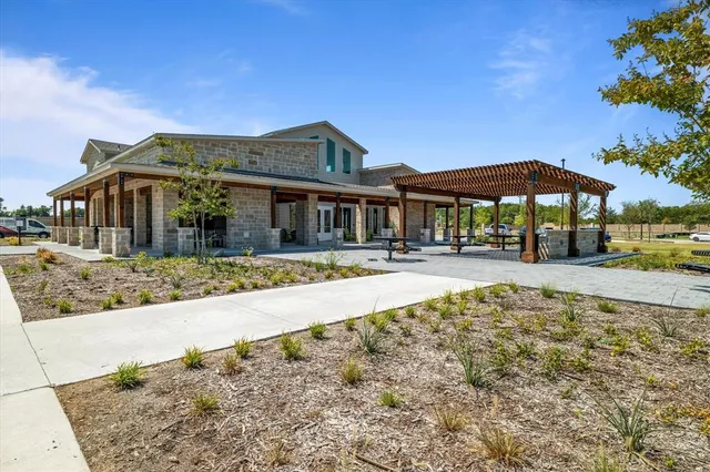 a view of a white house with a swimming pool