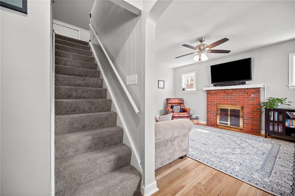 416 Phillips Avenue McKees Rocks, PA 15136 - Photo 5 of 46 a view of a livingroom with an empty kitchen and a fireplace
