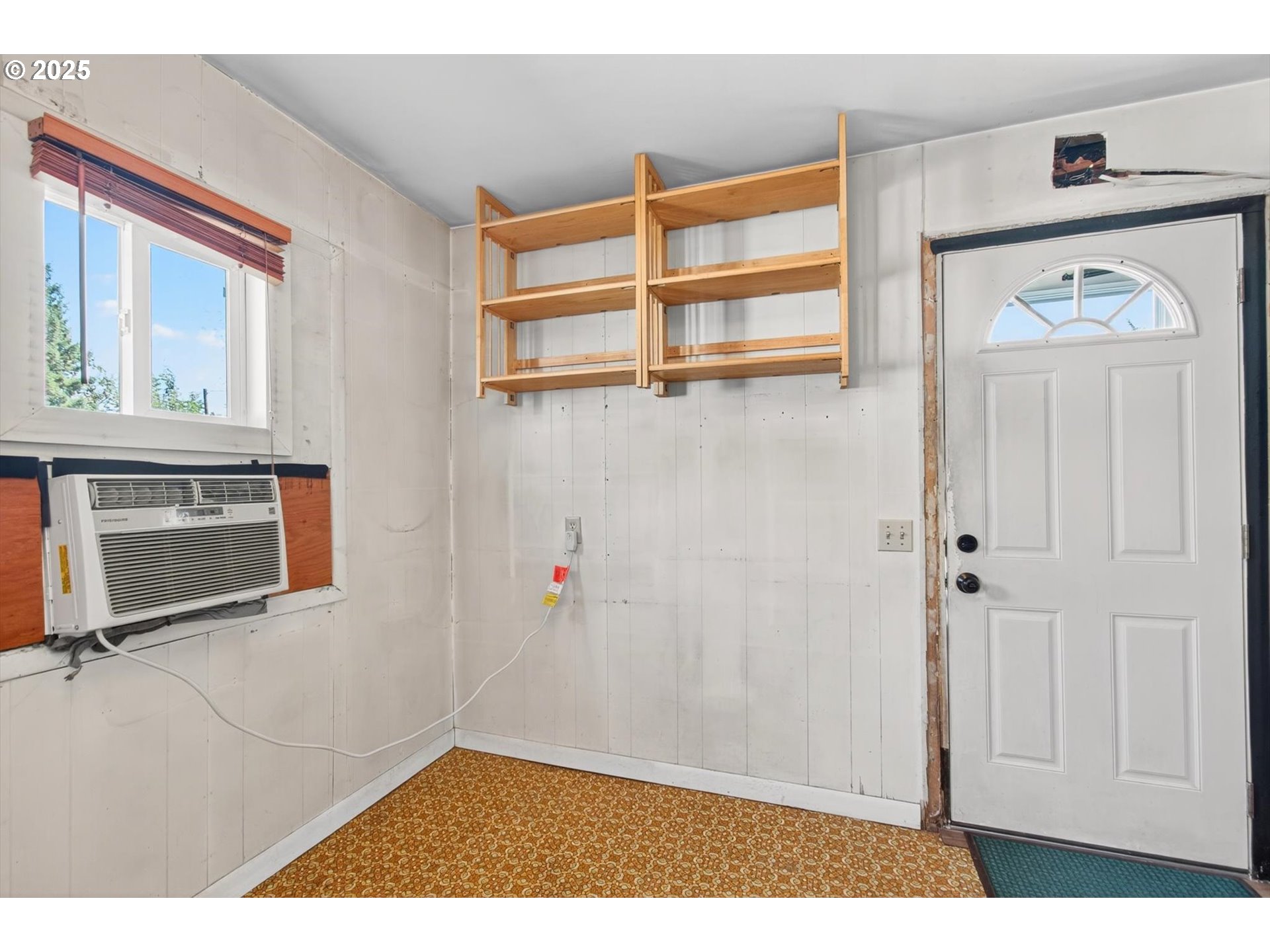 3945 Northeast Bryant Street Portland, OR 97211 - Photo 12 of 31 a view of a livingroom with wooden floor and kitchen view