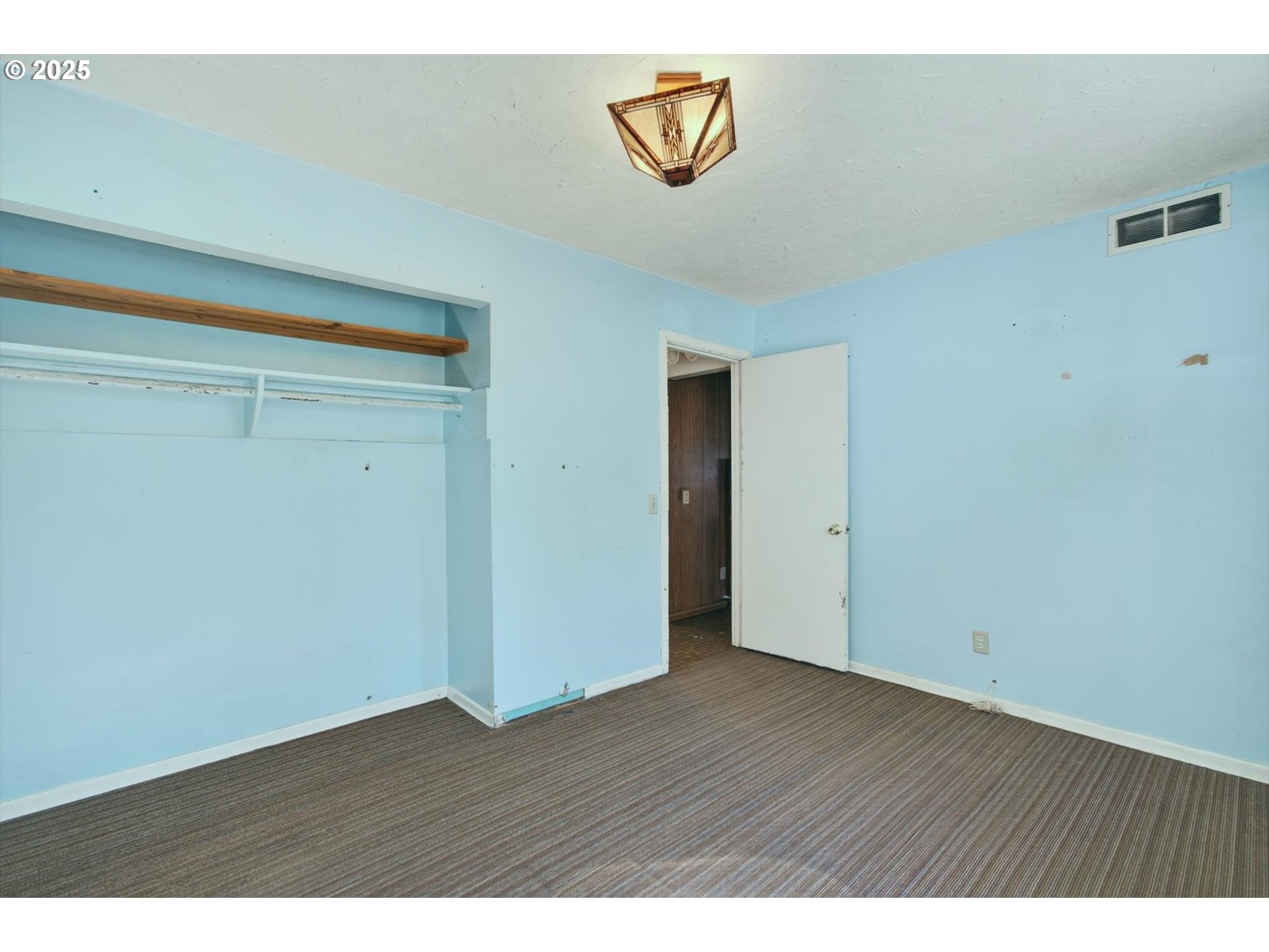 3945 Northeast Bryant Street Portland, OR 97211 - Photo 19 of 31 a view of an empty room with wooden floor