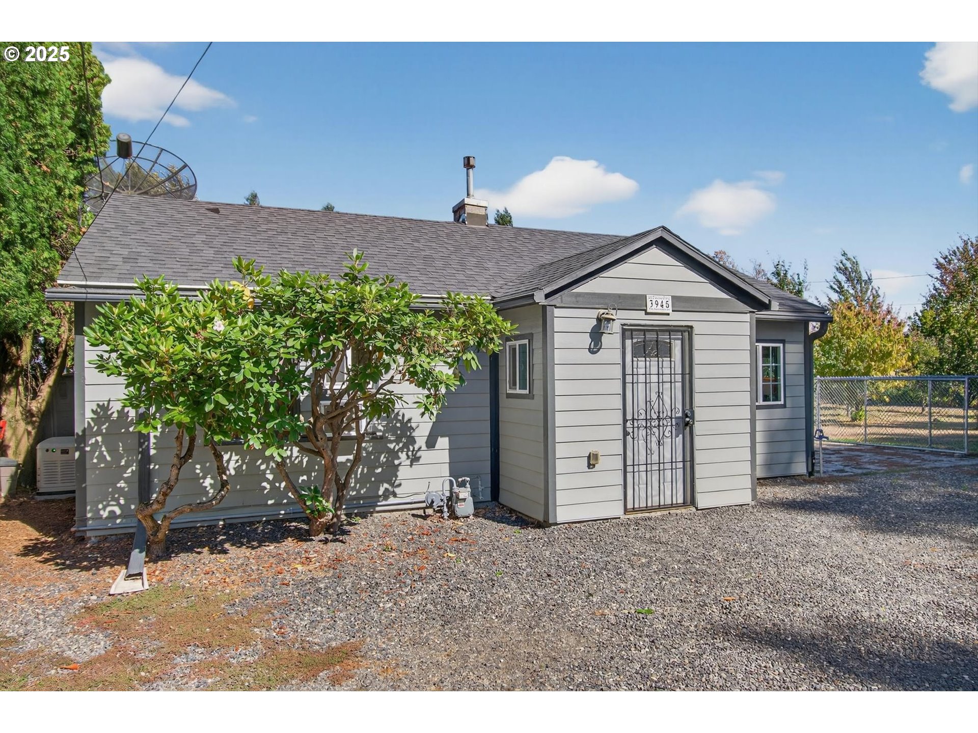 3945 Northeast Bryant Street Portland, OR 97211 - Photo 2 of 31 a view of a house with a yard and garage