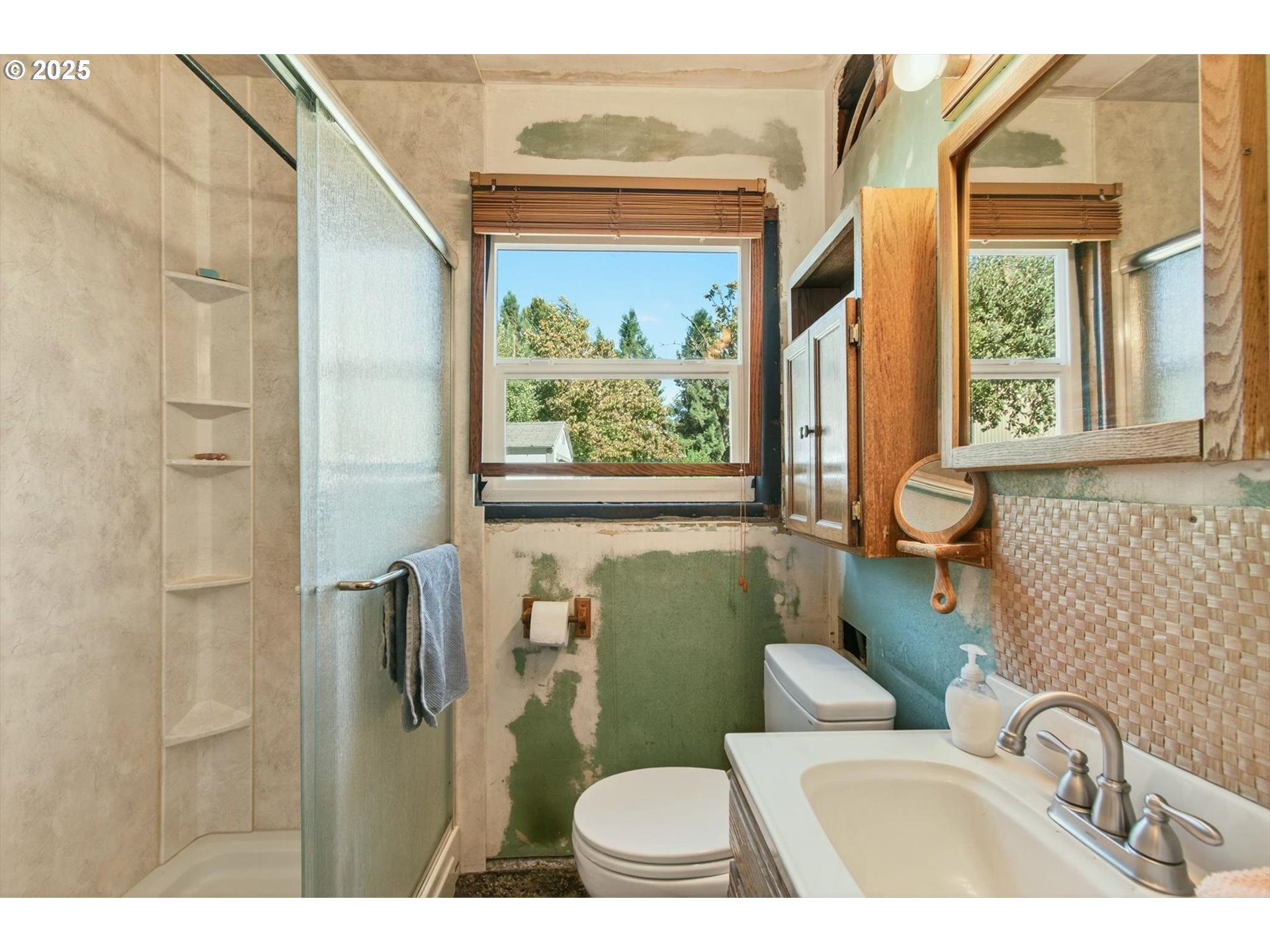 3945 Northeast Bryant Street Portland, OR 97211 - Photo 21 of 31 a bathroom with a toilet sink and tub