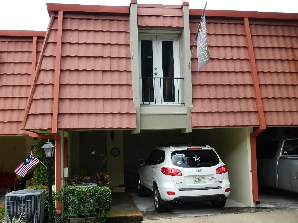 390 Golfview Road, Unit B North Palm Beach, FL 33408 - Photo 1 of 22 a car parked in front of a building