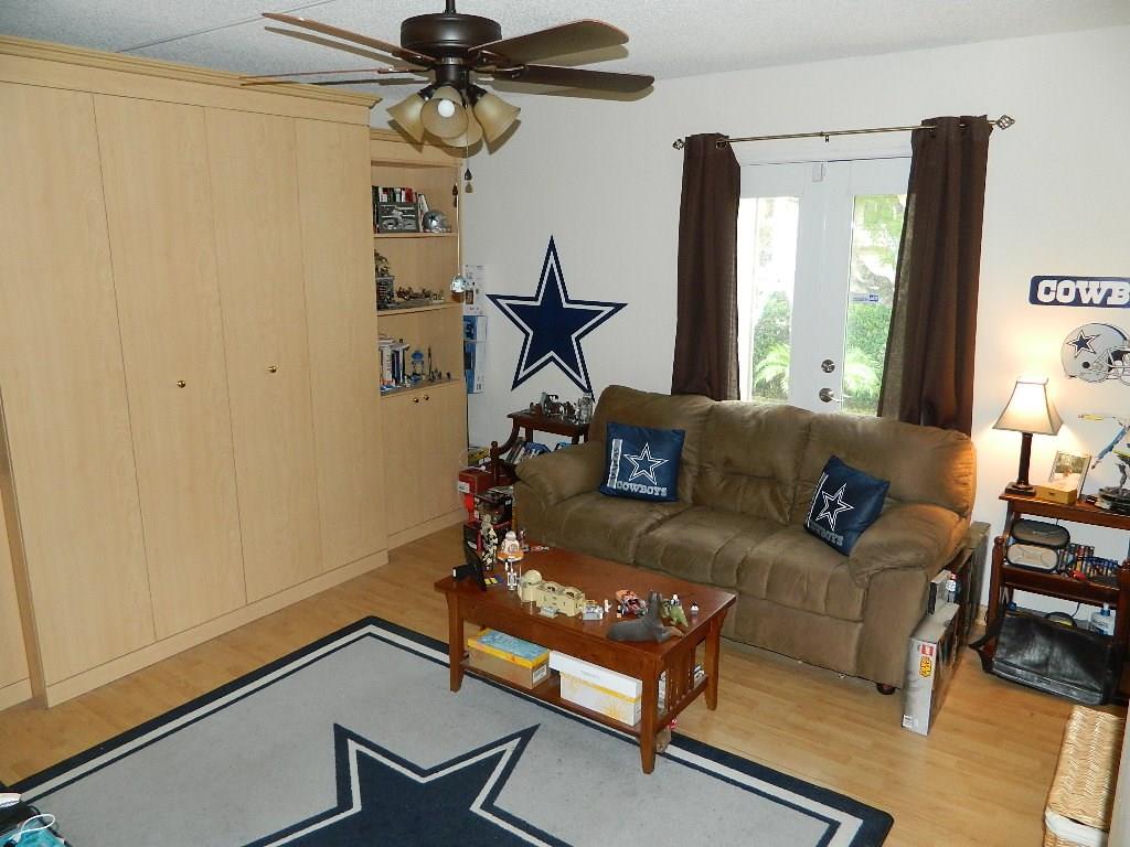 390 Golfview Road, Unit B North Palm Beach, FL 33408 - Photo 12 of 22 a living room with furniture and a window