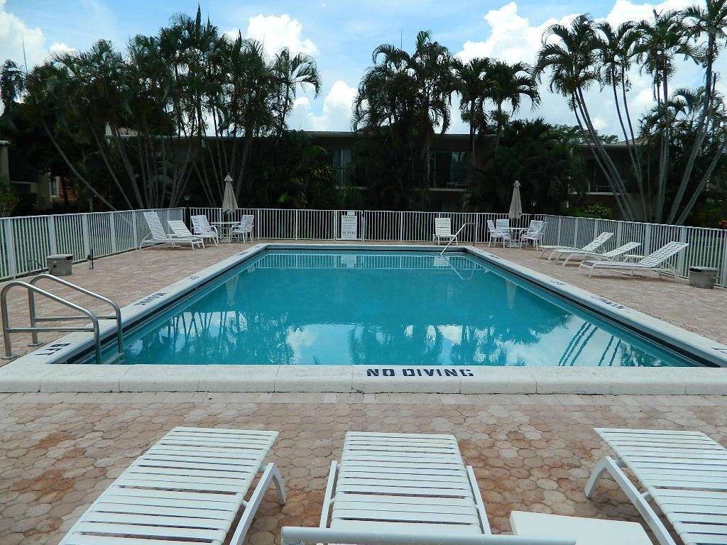390 Golfview Road, Unit B North Palm Beach, FL 33408 - Photo 14 of 22 a view of a swimming pool with a patio