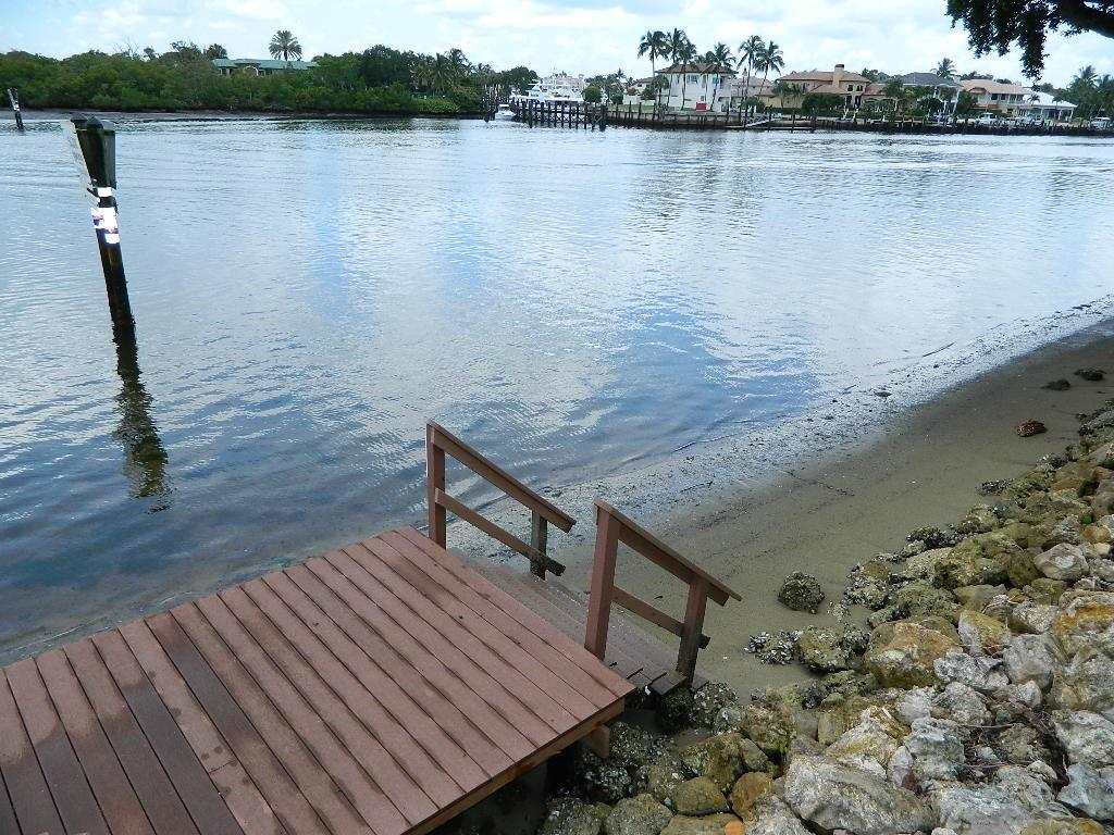 390 Golfview Road, Unit B North Palm Beach, FL 33408 - Photo 17 of 22 a view of a terrace with wooden floor and lake view