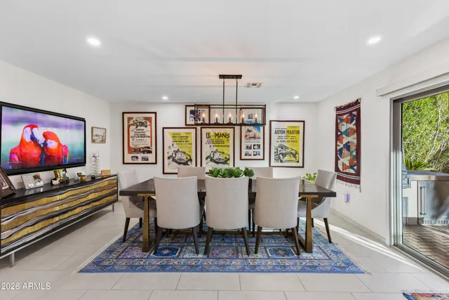 a kitchen with stainless steel appliances a refrigerator stove and white cabinets
