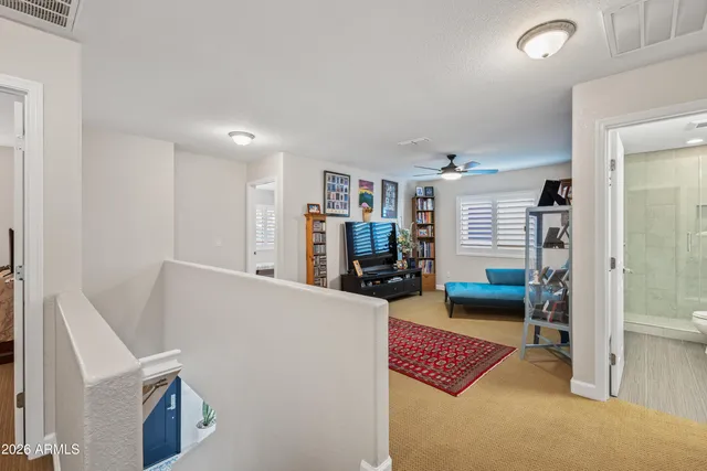 a bathroom with double sink and a mirror