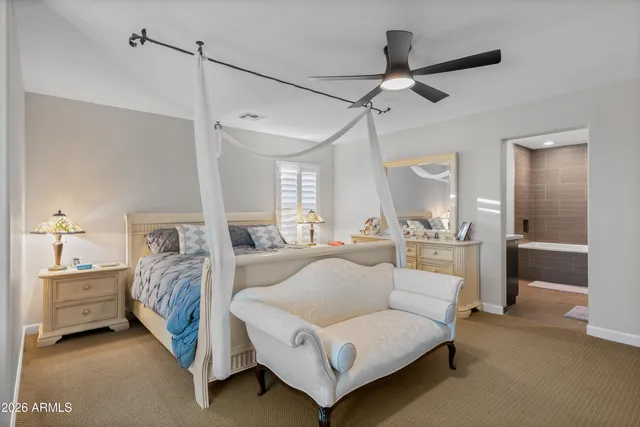 a bedroom with a bed and a couch