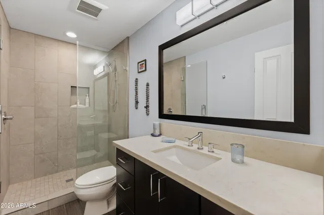 a view of a house with a swimming pool and outdoor seating