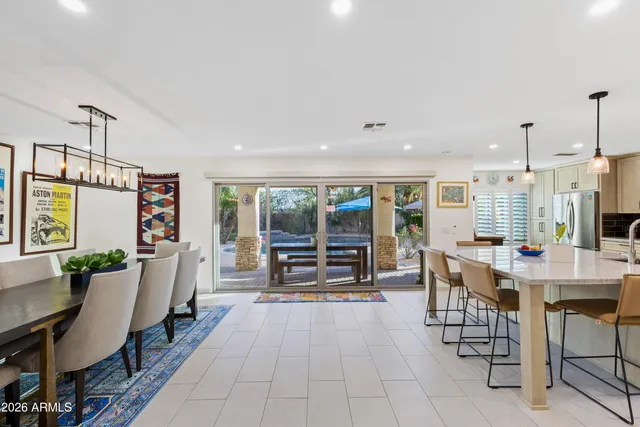 a kitchen with stainless steel appliances kitchen island granite countertop a sink and cabinets