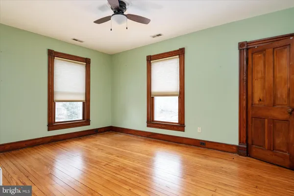 a view of walk in closet with clothes