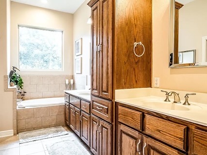 16308 Lake Loop Austin, TX 78734 - Photo 10 of 11 a bathroom with a sink and a bathtub