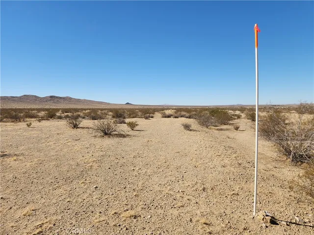 a view of an ocean beach and mountain