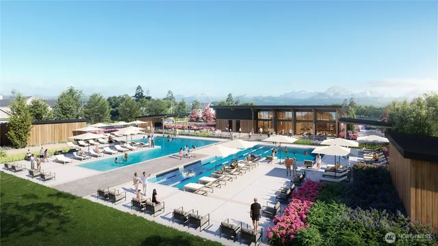 a view of a swimming pool and outdoor seating