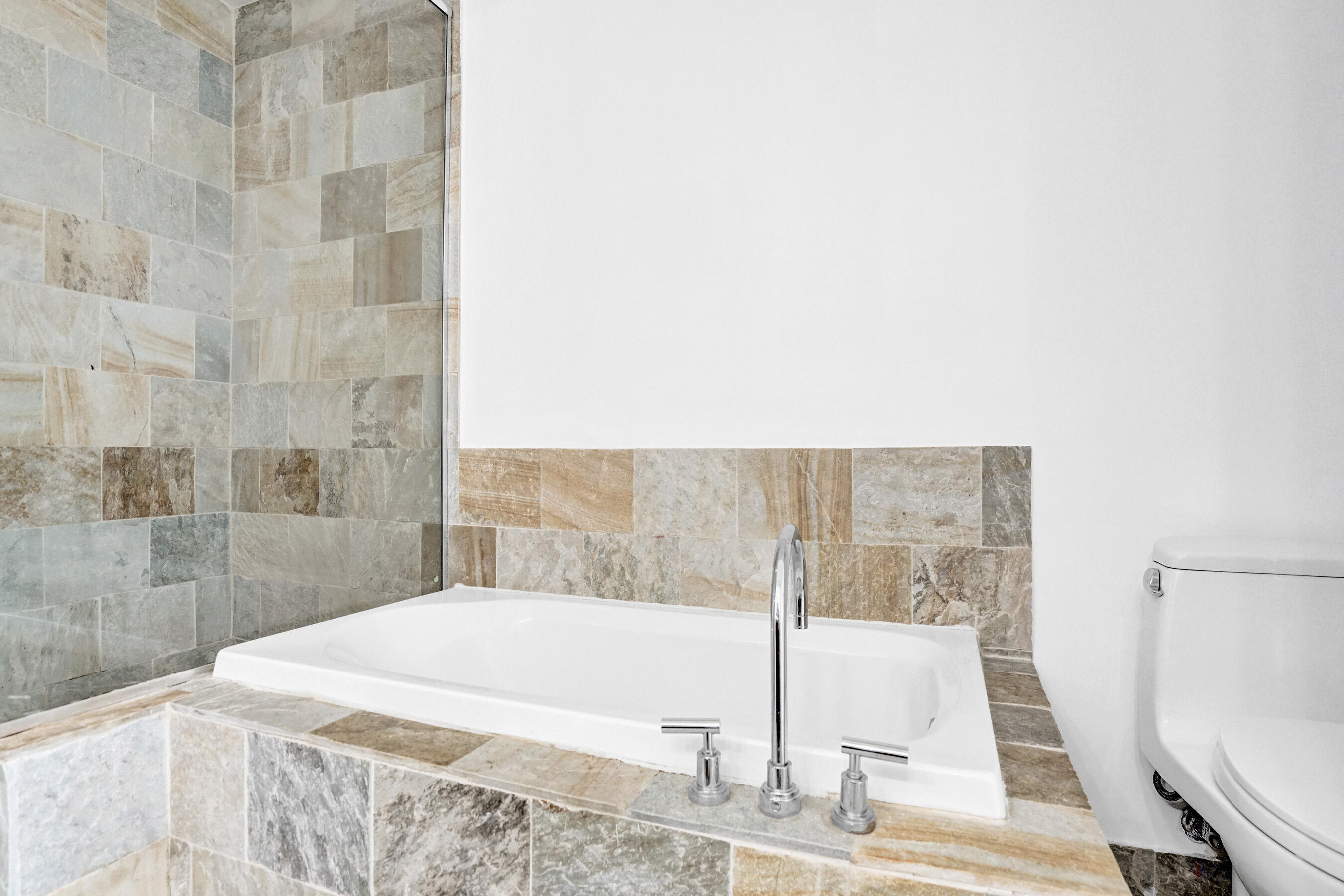 2641 North Flamingo Road, Unit 2105N Sunrise, FL 33323 - Photo 11 of 60 a bathroom with a bathtub and shower