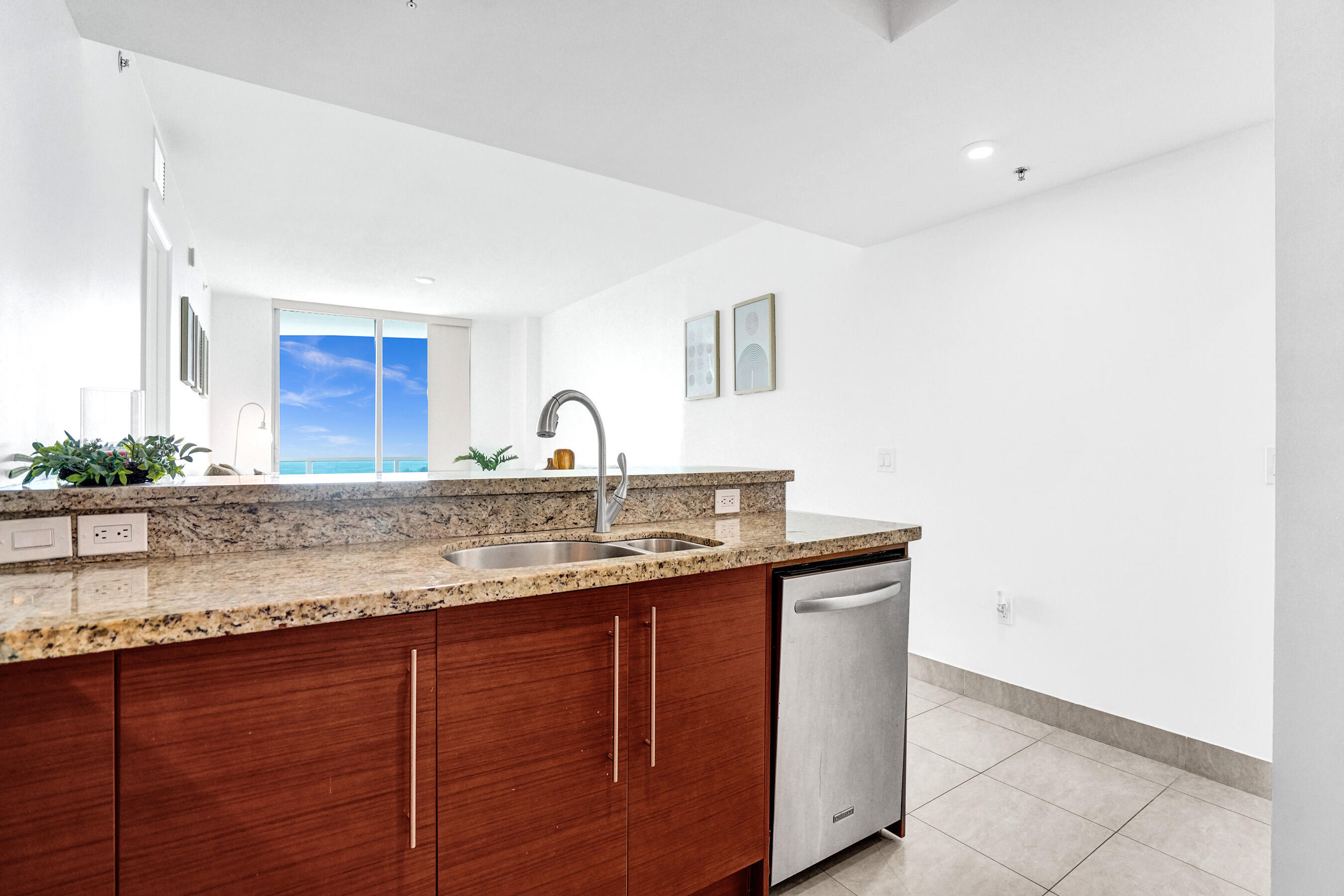 2641 North Flamingo Road, Unit 2105N Sunrise, FL 33323 - Photo 16 of 60 a kitchen with a sink and a cabinets