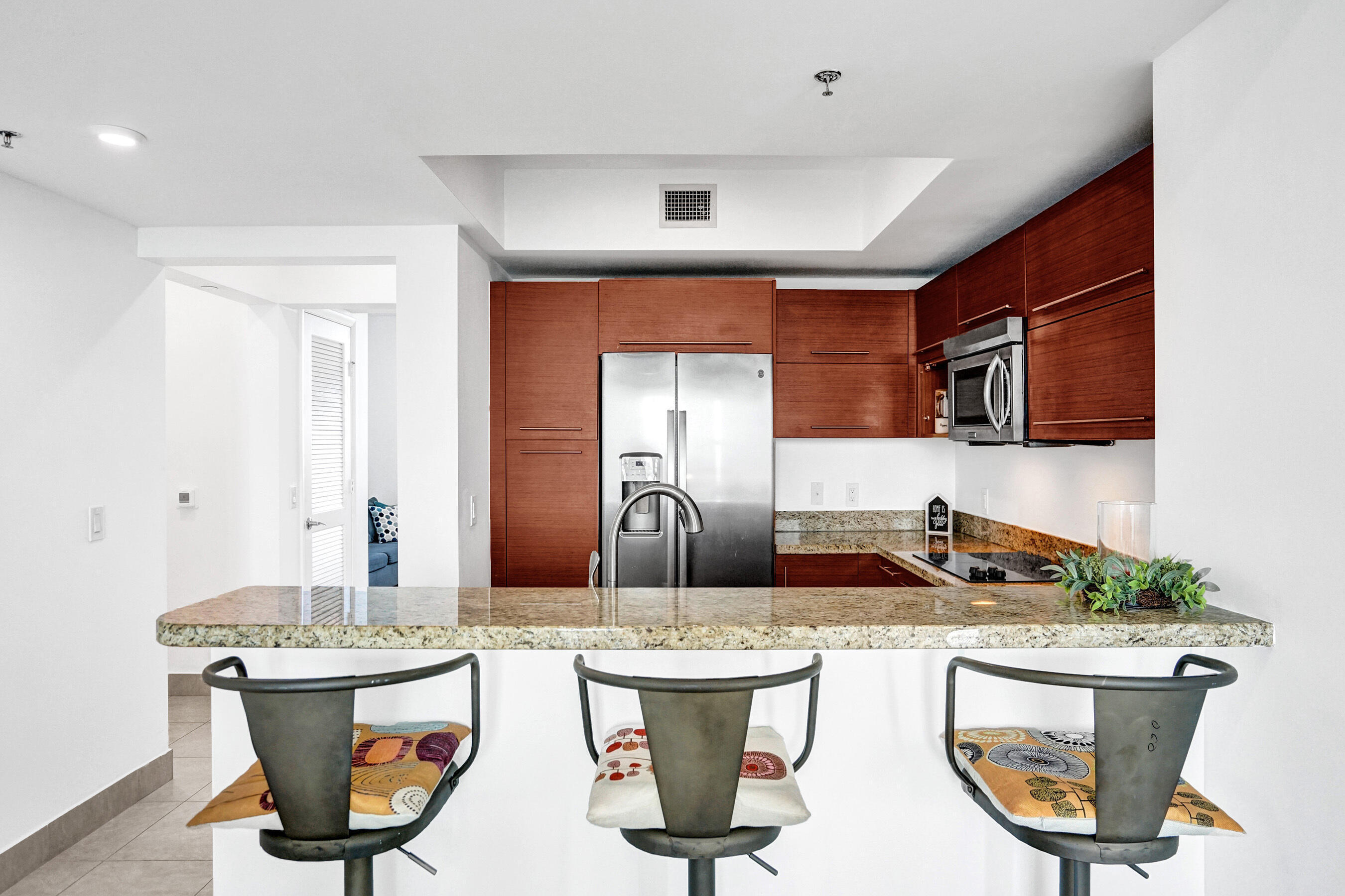 2641 North Flamingo Road, Unit 2105N Sunrise, FL 33323 - Photo 19 of 60 a kitchen with a sink and a refrigerator