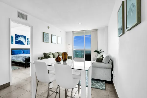a living room with furniture and a large window