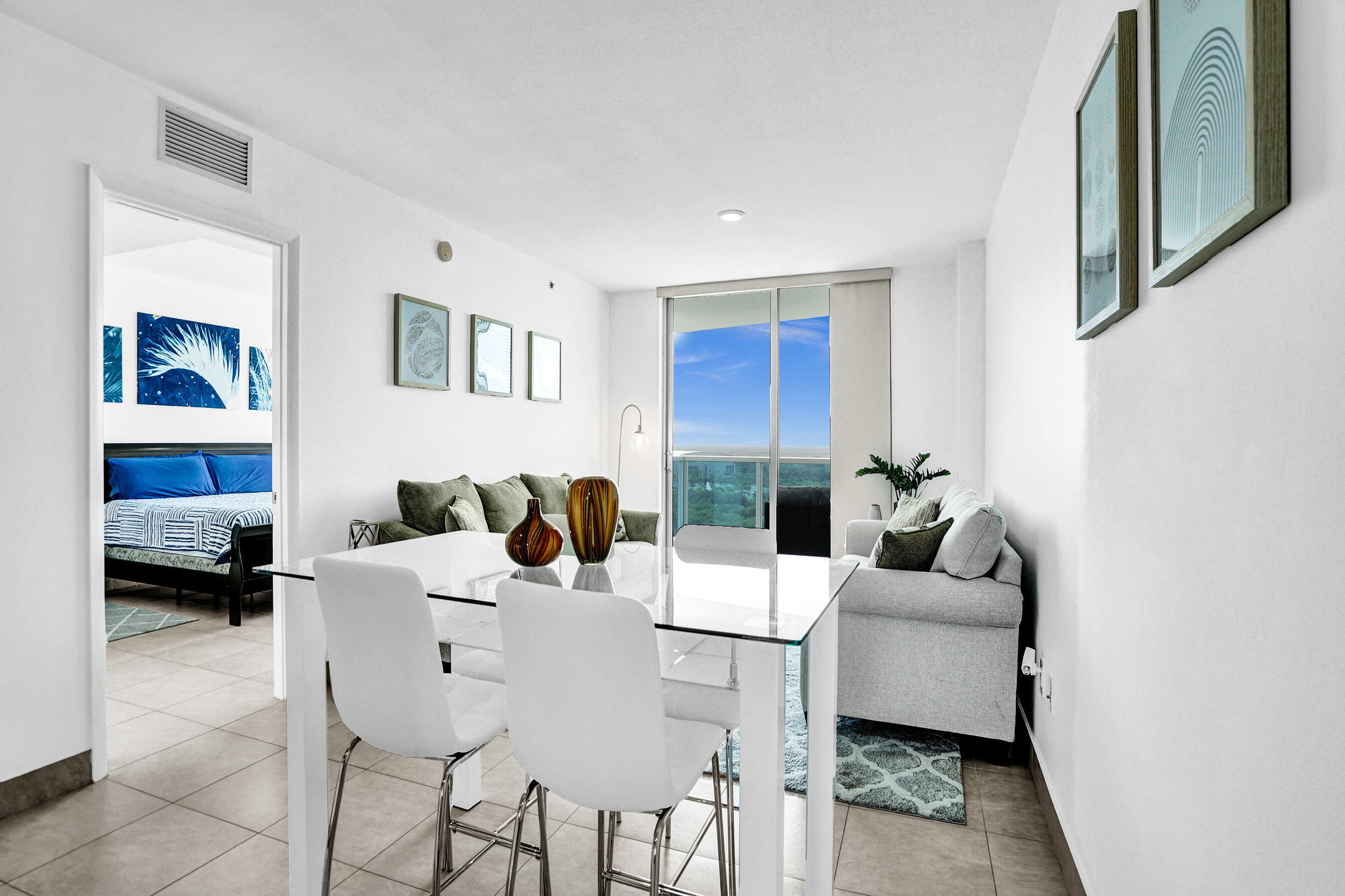 2641 North Flamingo Road, Unit 2105N Sunrise, FL 33323 - Photo 23 of 60 a living room with furniture and a lamp