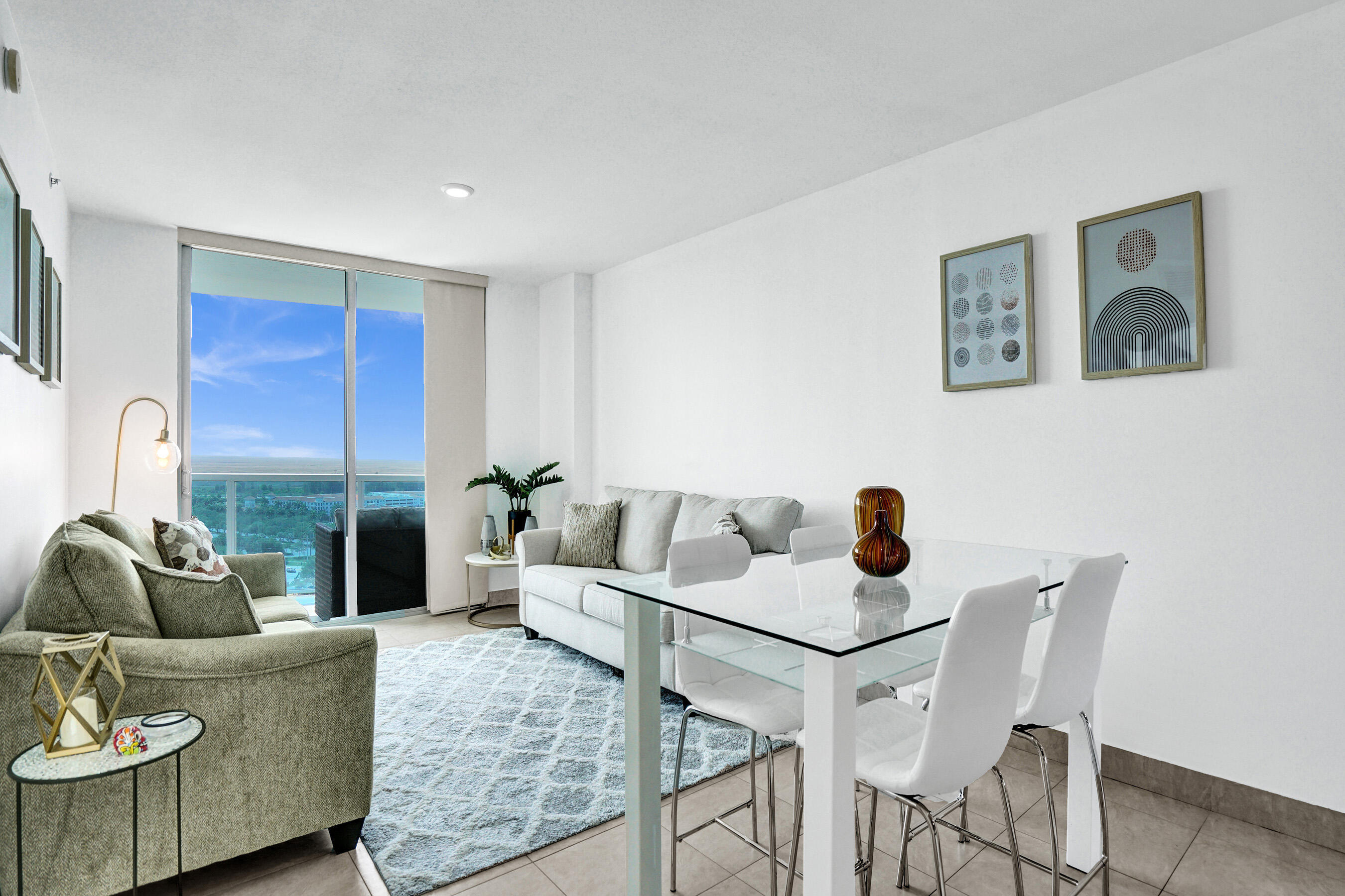 2641 North Flamingo Road, Unit 2105N Sunrise, FL 33323 - Photo 24 of 60 a living room with furniture and a large window