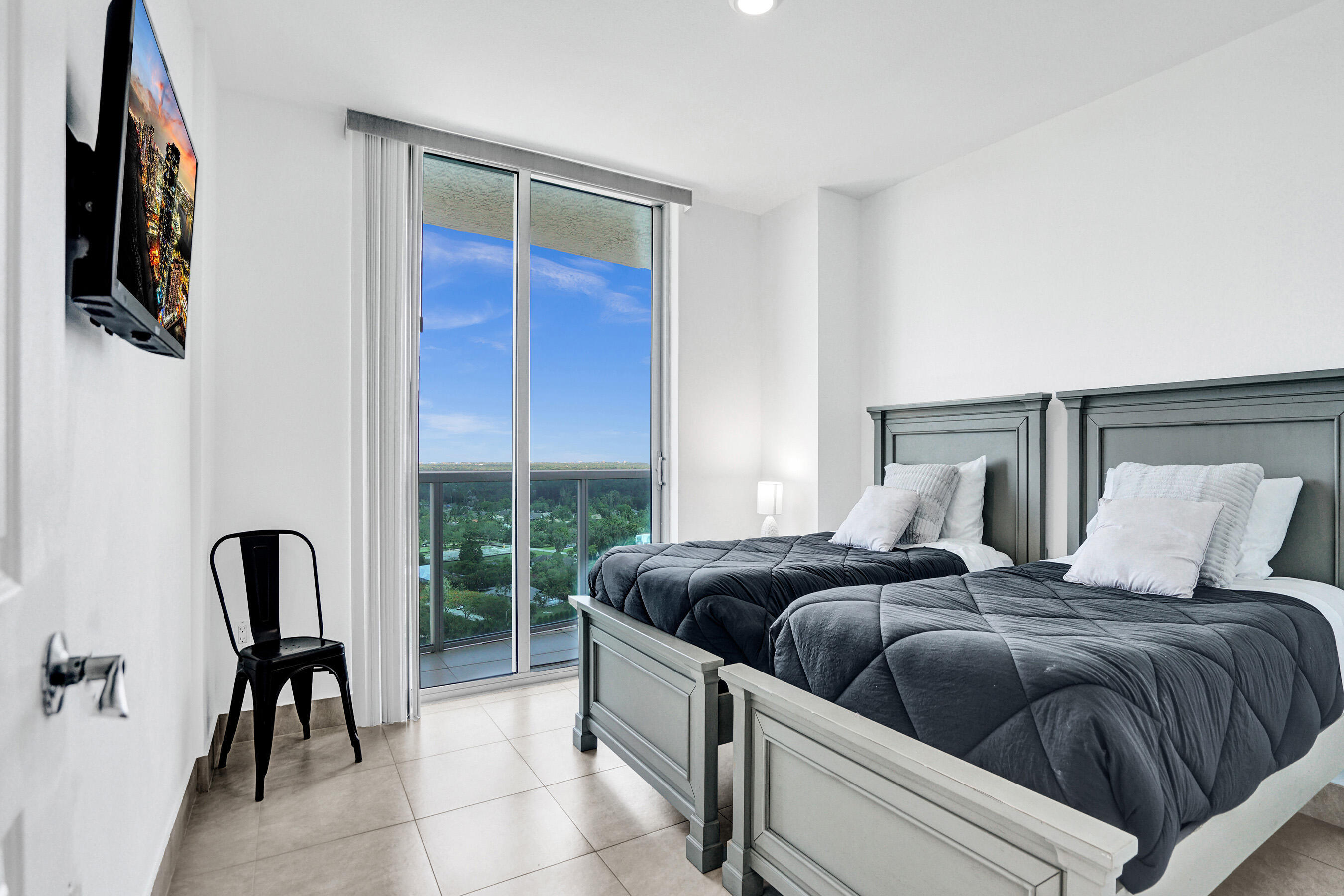 2641 North Flamingo Road, Unit 2105N Sunrise, FL 33323 - Photo 36 of 60 a bedroom with a bed and a window