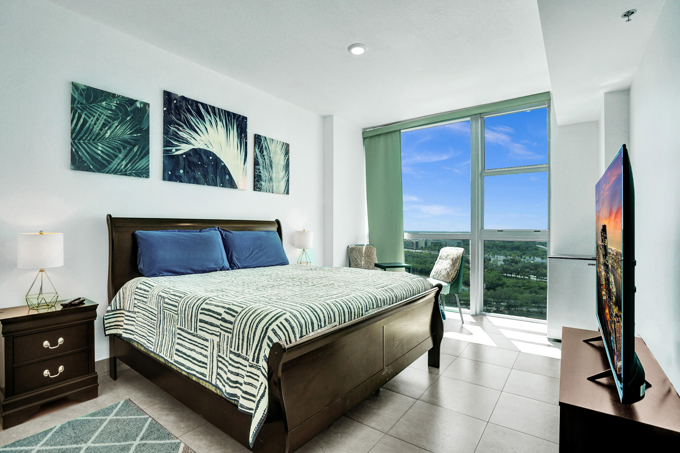 2641 North Flamingo Road, Unit 2105N Sunrise, FL 33323 - Photo 4 of 60 a bedroom with a bed and a dresser